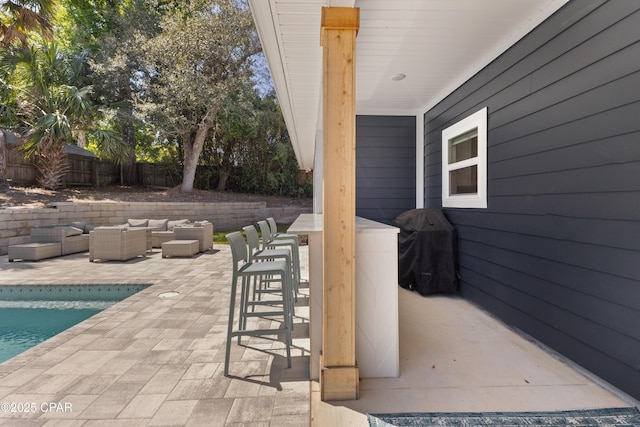 1106 E 3rd St, Panama City, FL 32401 - view of patio featuring an outdoor living space, a fenced in pool, fence, and outdoor dry bar