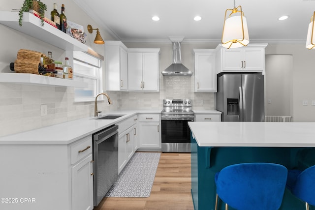 1106 E 3rd St, Panama City, FL 32401 - kitchen featuring light wood-style flooring, a sink, open shelves, wall chimney exhaust hood, and appliances with stainless steel finishes