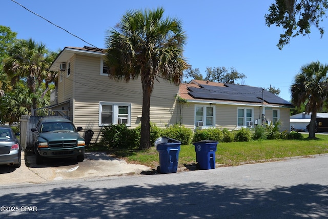 view of side of property featuring a yard