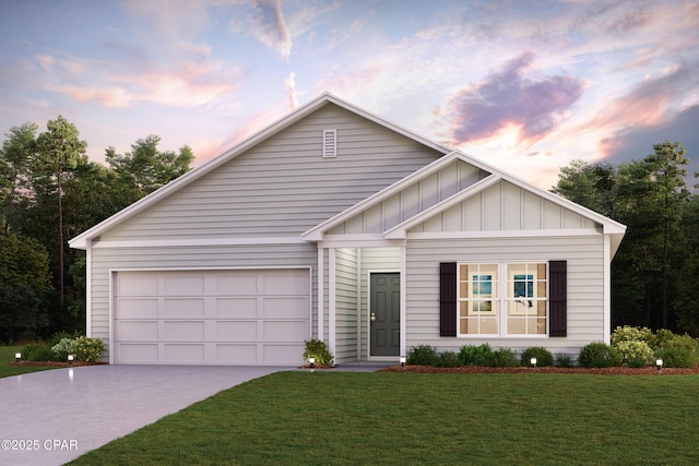 8028 Greyling Cir, Youngstown, FL 32466 - view of front facade with board and batten siding, driveway, a front yard, and an attached garage