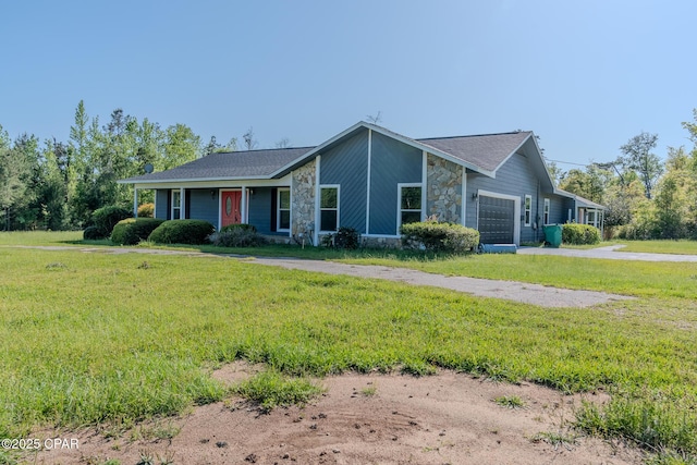 2613 Indian Springs Rd, Marianna, FL 32446 - view of front of home with a front yard, driveway, stone siding, and an attached garage