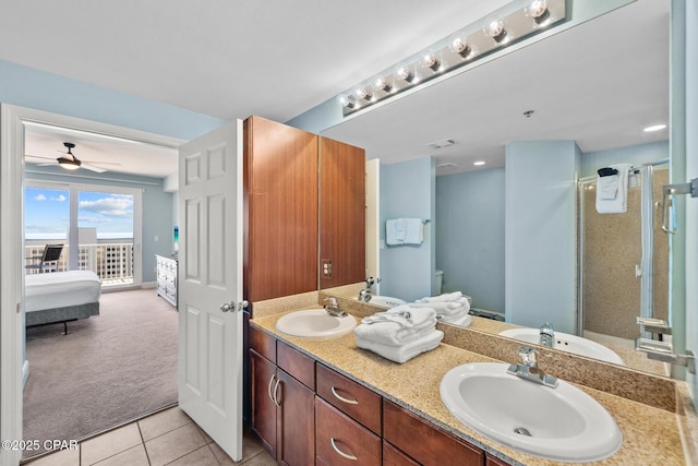 full bathroom with ensuite bath, a stall shower, a ceiling fan, tile patterned flooring, and double vanity