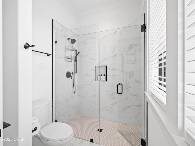 full bath with toilet, marble finish floor, and a marble finish shower