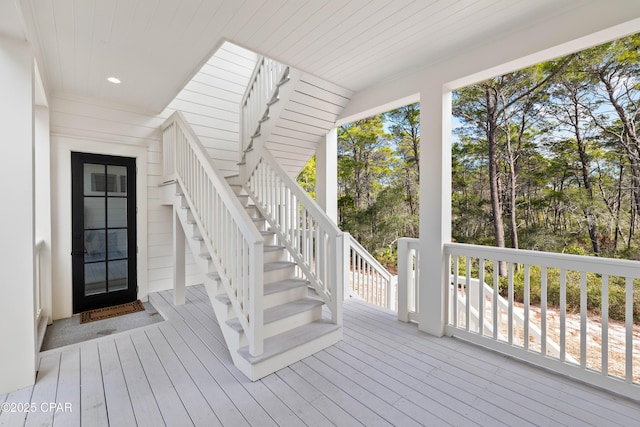 wooden terrace featuring stairs