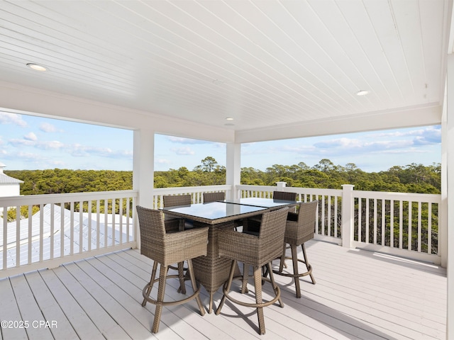 wooden terrace featuring outdoor dining space