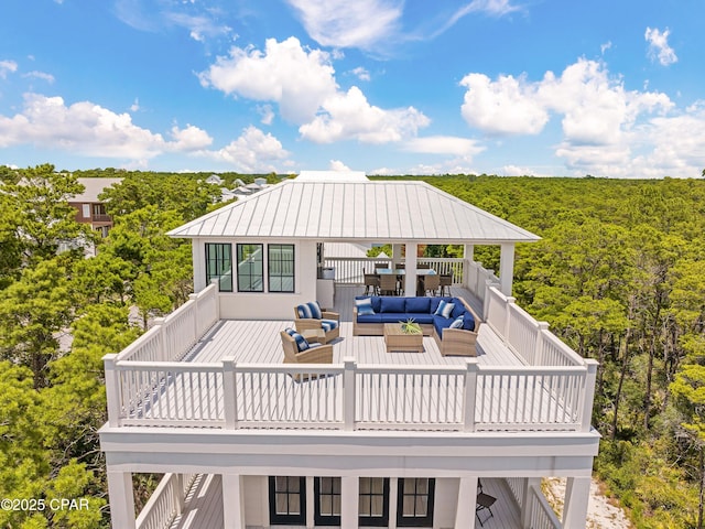 exterior space featuring a view of trees and an outdoor hangout area