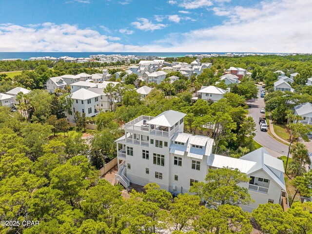 bird's eye view featuring a residential view and a water view
