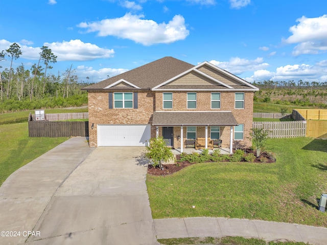 3946 Whitehead Blvd, Panama City, FL 32404 - traditional home with brick siding, an attached garage, driveway, and covered porch