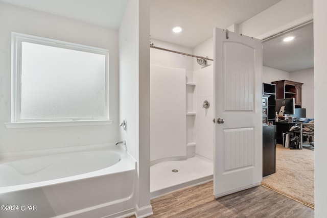 3946 Whitehead Blvd, Panama City, FL 32404 - bathroom with a bath, recessed lighting, wood finished floors, and a stall shower