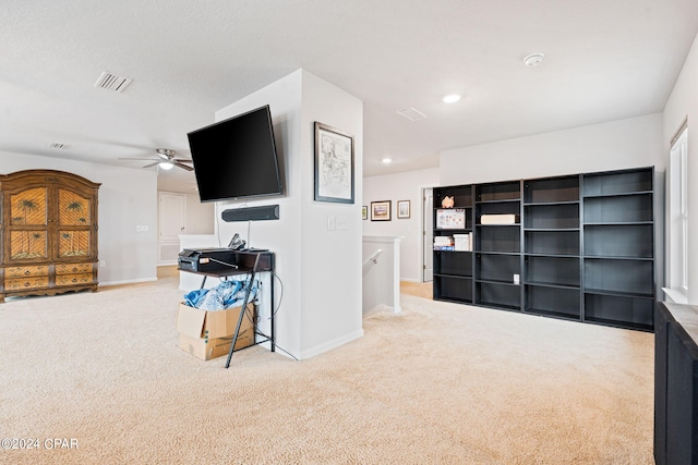 3946 Whitehead Blvd, Panama City, FL 32404 - sitting room with carpet, visible vents, a ceiling fan, an upstairs landing, and baseboards