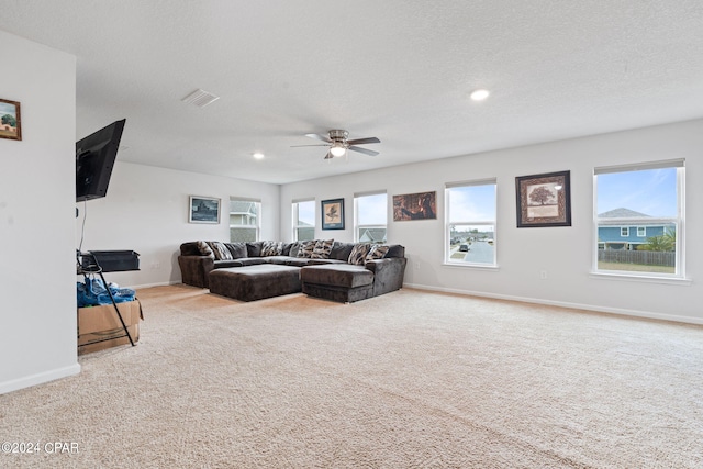 3946 Whitehead Blvd, Panama City, FL 32404 - carpeted living room featuring recessed lighting, visible vents, baseboards, a textured ceiling, and ceiling fan