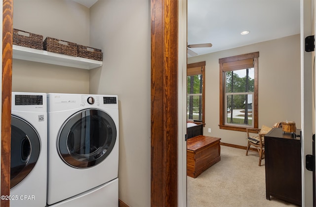 washroom featuring washing machine and dryer, baseboards, recessed lighting, light colored carpet, and laundry area