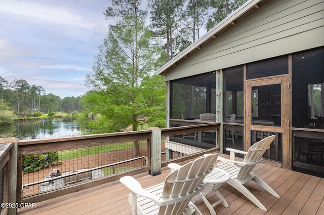 deck featuring a sunroom and a water view