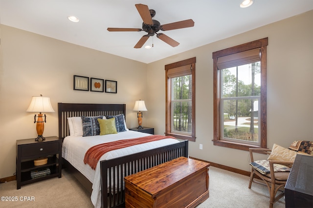 bedroom featuring light colored carpet, ceiling fan, baseboards, and recessed lighting