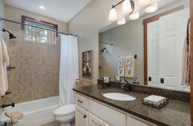 full bath with shower / tub combo, vanity, and toilet