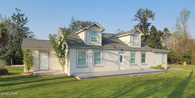 back of property featuring a lawn