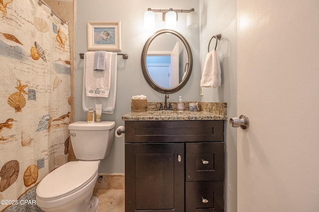 full bathroom with toilet and vanity