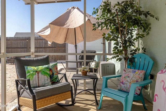 view of patio / terrace with an outdoor hangout area and fence