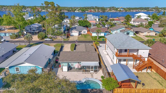 drone / aerial view featuring a water view and a residential view