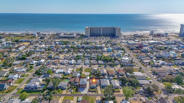 drone / aerial view featuring a water view and a residential view