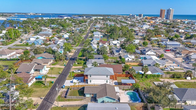 birds eye view of property with a water view and a residential view