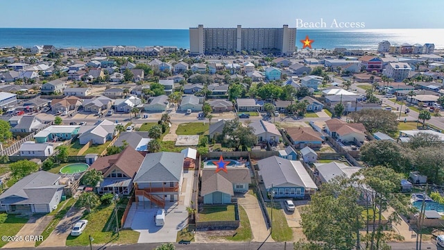 drone / aerial view with a residential view and a water view
