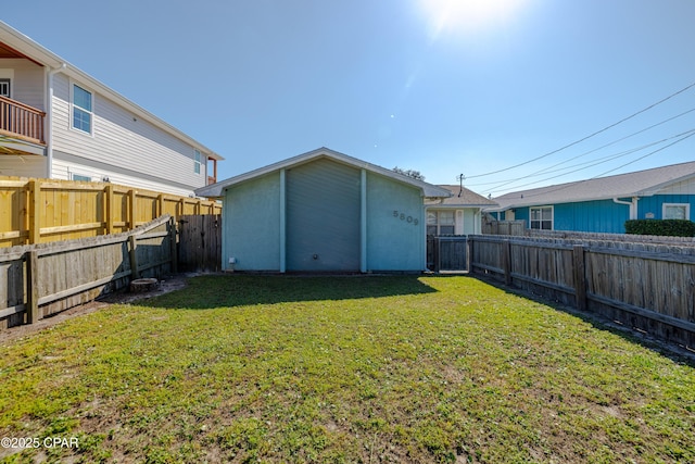back of property with a yard and a fenced backyard