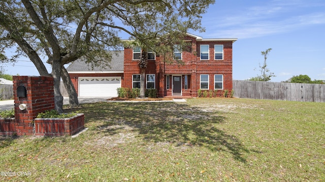 view of front of house featuring a front yard, driveway, brick siding, an attached garage, and fence