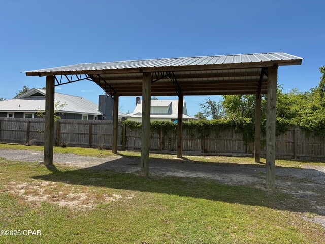 2435 Amherst St, Lynn Haven, FL 32444 - view of yard featuring a carport and fence