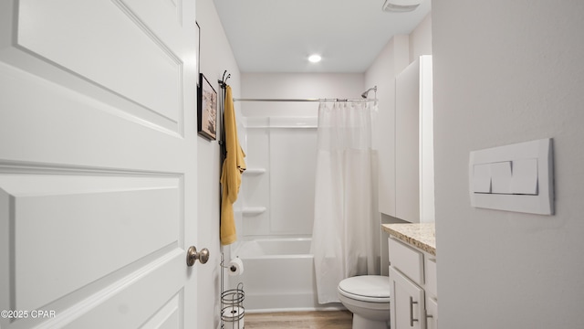 bathroom with vanity, toilet, shower / bath combination with curtain, wood finished floors, and visible vents
