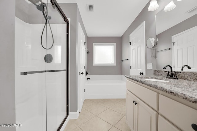 full bathroom with a shower stall, vanity, visible vents, and a garden tub