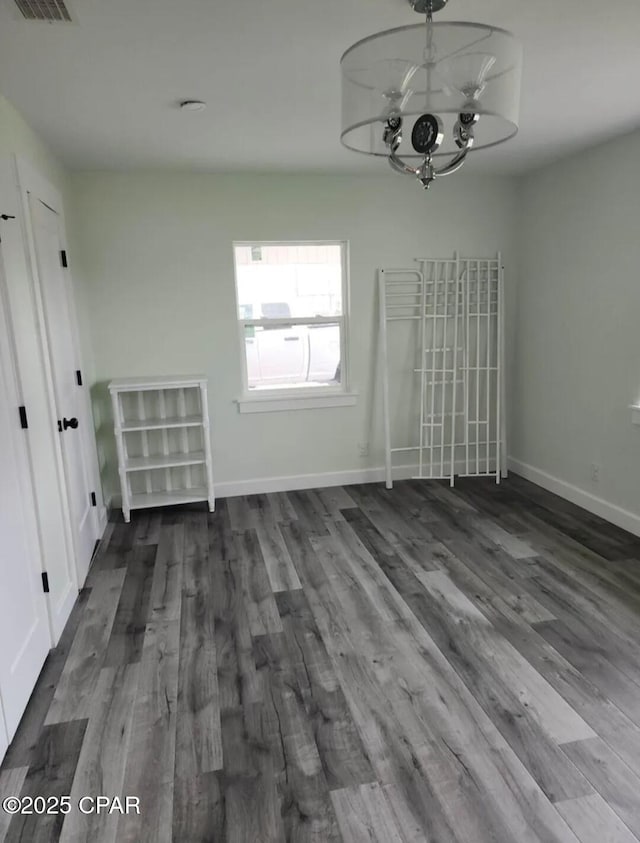 1301 New York Ave, Lynn Haven, FL 32444 - unfurnished dining area featuring dark wood-style floors and a chandelier