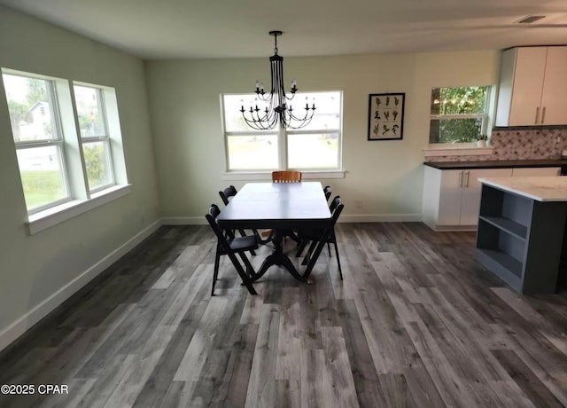 1301 New York Ave, Lynn Haven, FL 32444 - dining space featuring healthy amount of natural light, a chandelier, and dark wood-style floors
