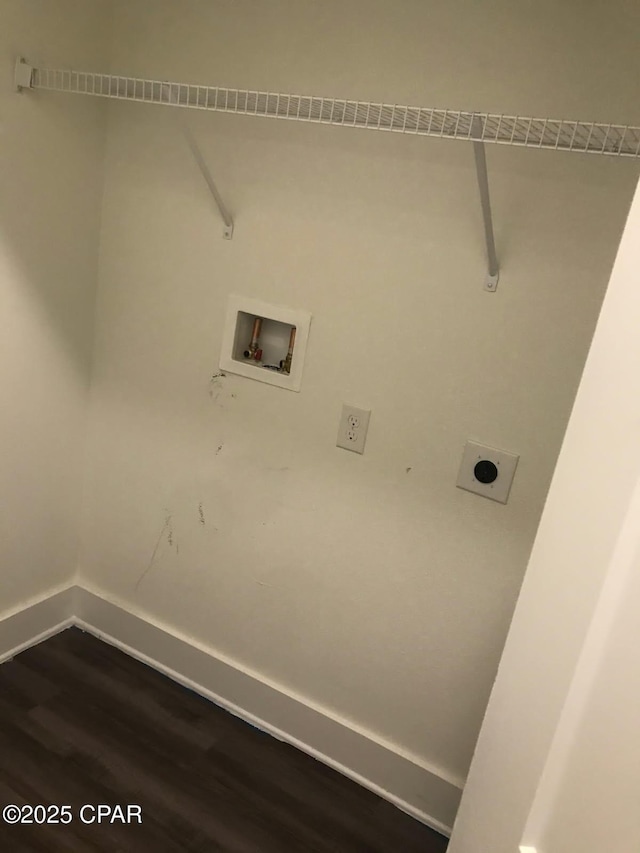 clothes washing area with electric dryer hookup, baseboards, washer hookup, dark wood-type flooring, and laundry area