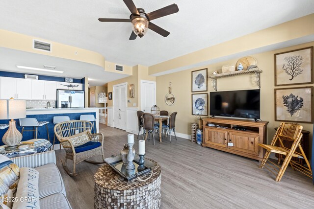 15928 Front Beach Rd Unit 3 2005, Panama City Beach, FL 32413 - living room featuring light wood-style flooring, ceiling fan, and baseboards