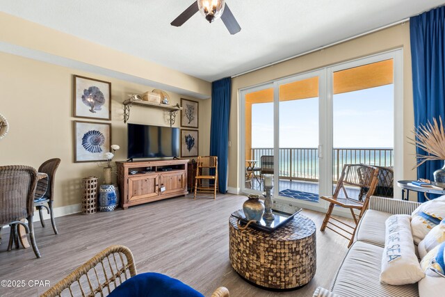 15928 Front Beach Rd Unit 3 2005, Panama City Beach, FL 32413 - living area featuring ceiling fan, wood finished floors, and baseboards
