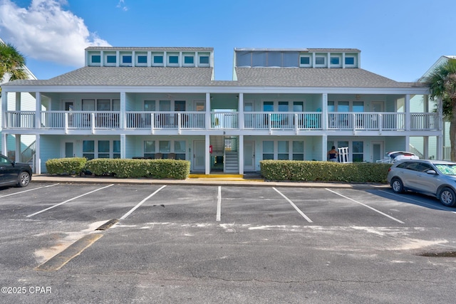 17670 Front Beach Rd Unit B8, Panama City Beach, FL 32413 - view of building exterior featuring uncovered parking