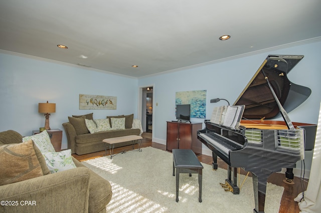 living room featuring crown molding, wood finished floors, and recessed lighting