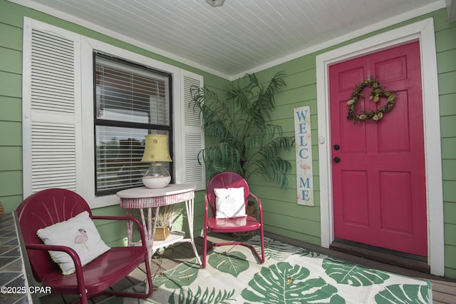 view of exterior entry with covered porch