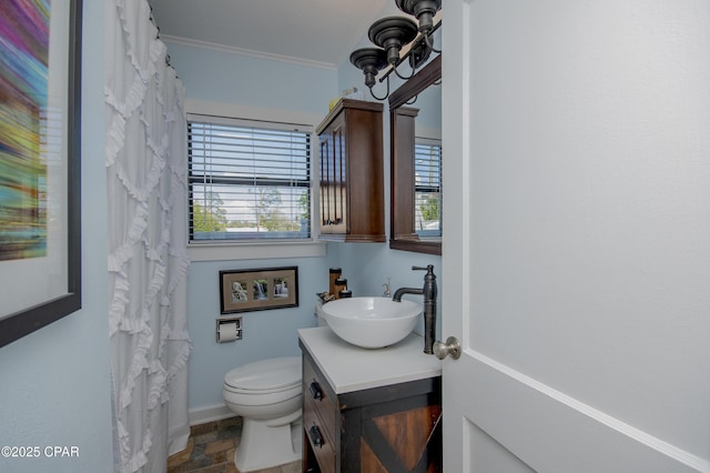 106 N Cove Blvd, Panama City, FL 32401 - bathroom with vanity, toilet, crown molding, stone finish flooring, and a shower with curtain