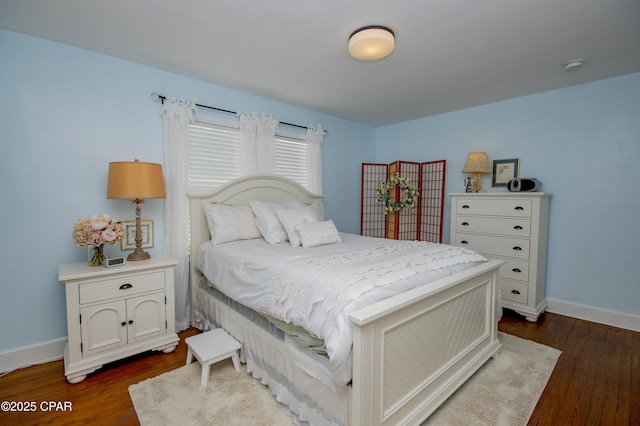 106 N Cove Blvd, Panama City, FL 32401 - bedroom with dark wood-style floors and baseboards