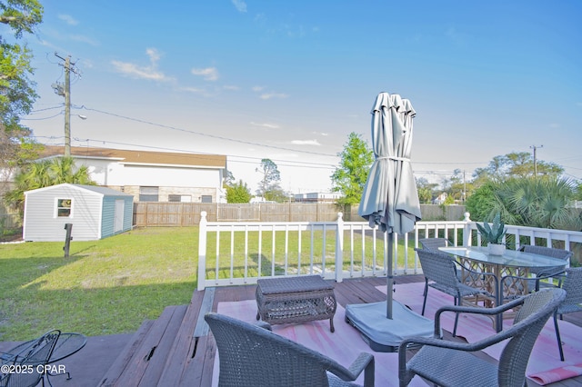 106 N Cove Blvd, Panama City, FL 32401 - deck with an outdoor structure, outdoor dining area, and a storage unit