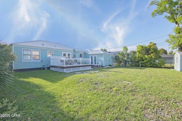 106 N Cove Blvd, Panama City, FL 32401 - view of grassy yard featuring a deck and french doors