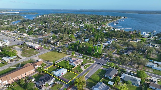 birds eye view of property with a residential view and a water view