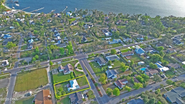 drone / aerial view with a residential view and a water view