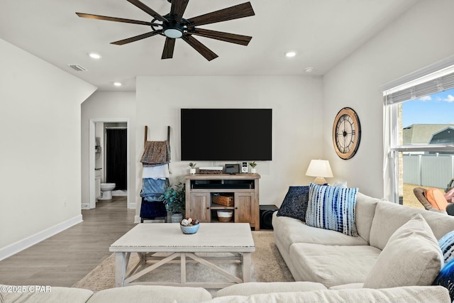 living area featuring visible vents, recessed lighting, light wood-style flooring, and ceiling fan
