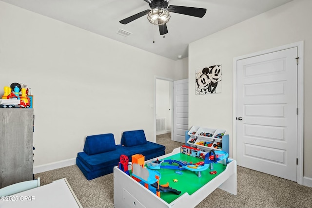 game room with baseboards, carpet flooring, a ceiling fan, and visible vents