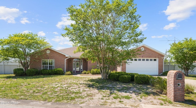 view of front facade featuring brick siding, fence, and an attached garage