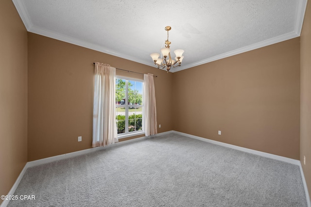 carpeted empty room featuring a chandelier, baseboards, a textured ceiling, and crown molding