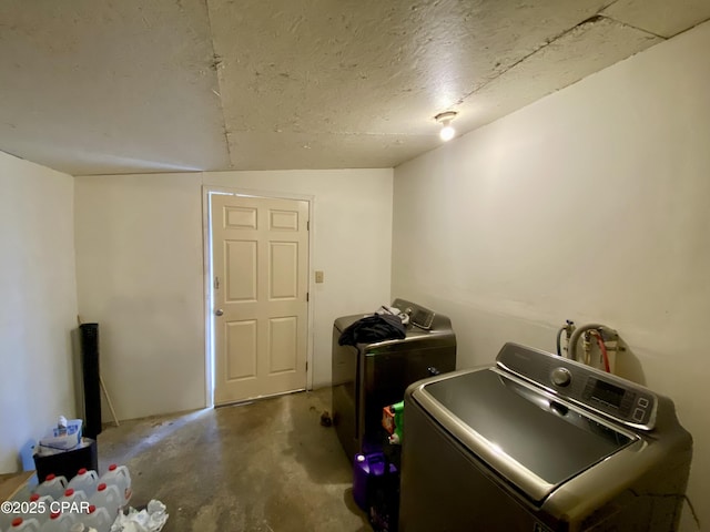 laundry area featuring a textured ceiling, laundry area, and washer hookup